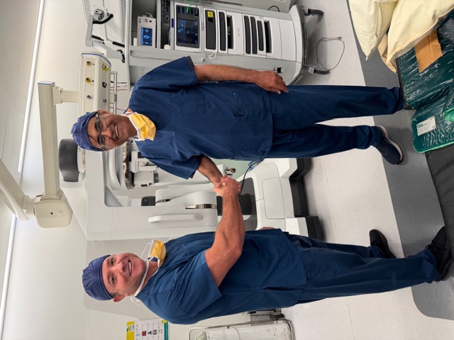 Dr Raji Kooner with Dr Ryan Nelson on completion of surgery